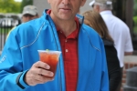 man toasting his bloody mary