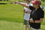 woman pointing on golf course