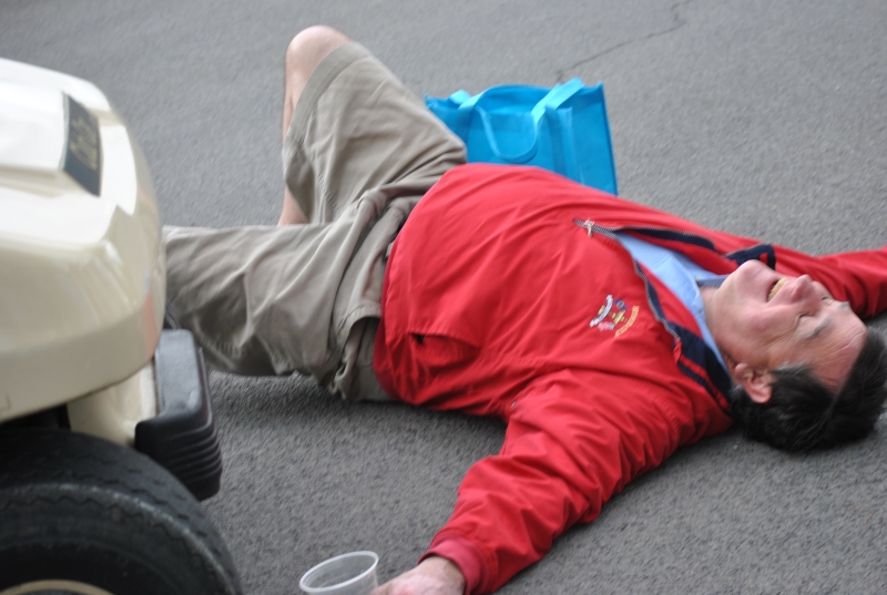 man laying on pavement