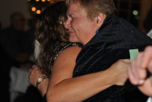 woman giving big hug to another woman