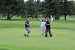 group of golfers celebrating