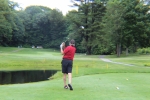man driving off the tee box