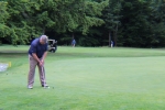 man putting onto the green