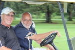 two golfers in their cart