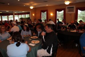 golfers enjoying post match meal in dining area