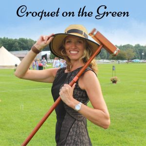 Woman holding brim of her sun hat and croquet mallet over her shoulder with text along top of image that says "Croquet on the Green"