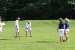 Group of people playing croquet at AIM Services event