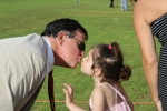 father kissing daughter