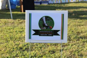 2nd annual croquet on the green sign in the ground