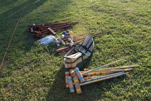 pile of croquet materials on ground in preparation on big day