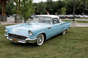 old school baby blue muscle car with whitewall tires