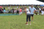 two people in fedoras playing croquet