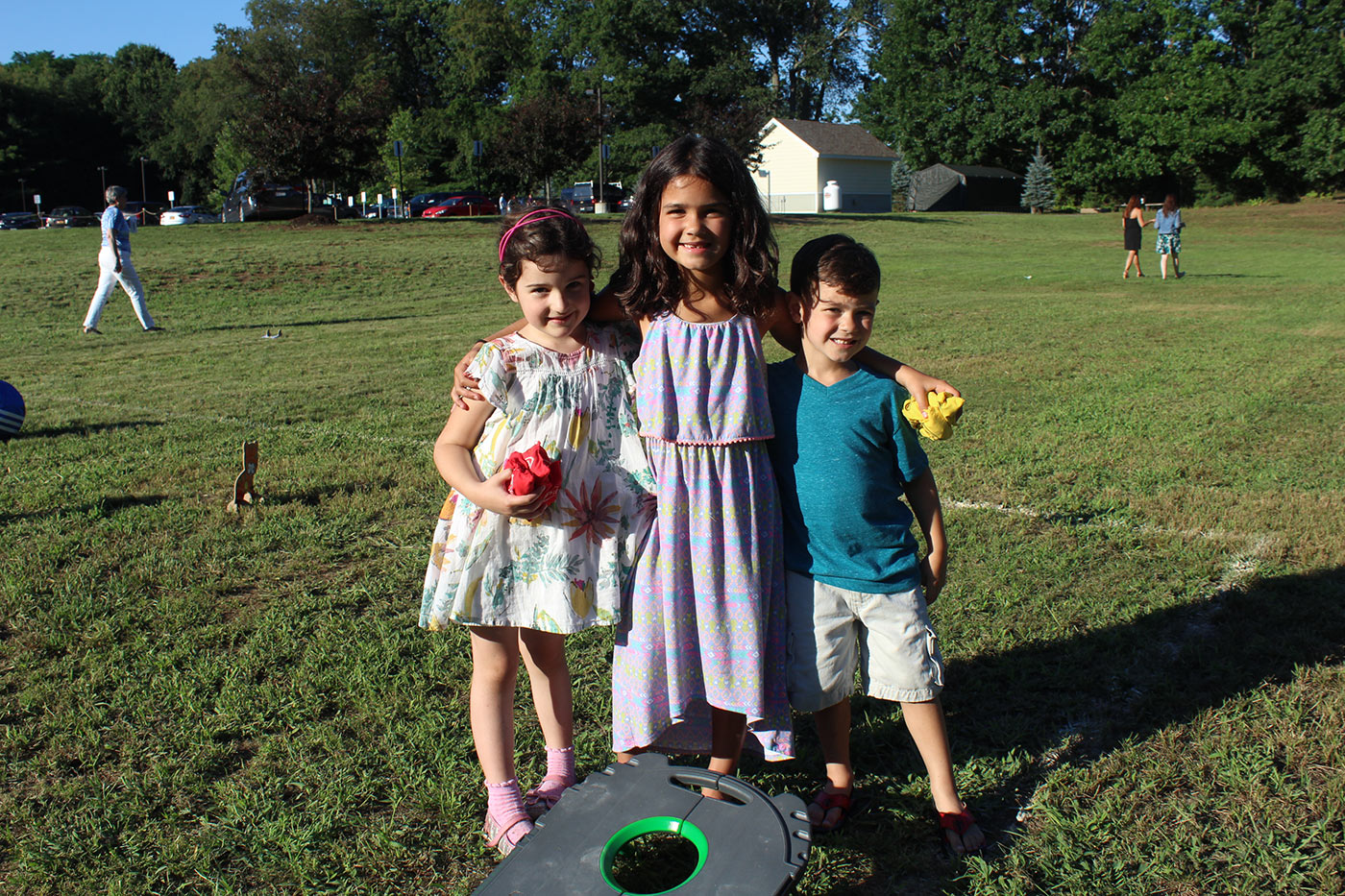three children posing together