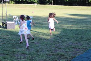 children running towards yard