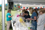 party goers looking at raffle baskets
