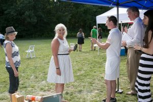 woman looking trying to woo the croquet judge