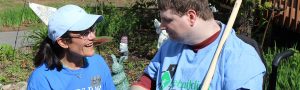 AIM Services Team Member Encouraging a Developmentally Disabled Person