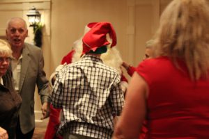 very excited guests greeting santa claus