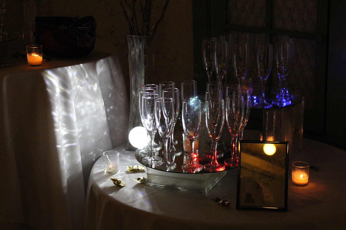 red, white and blue lights shining through tasting glasses