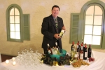 bartender posing with his wines available for guests