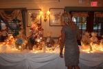 Vin Le Soir to benefit AIM Services, Inc. woman looking at raffle baskets