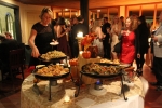 woman getting food at catering table