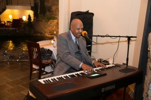 man giving the party some music playing the piano