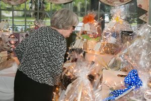 woman looking at content in the gift baskets