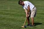 Man hiiting ball on the Croquet on the Green