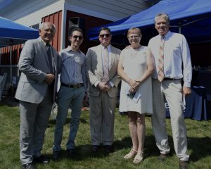 group of five standing on the yard and smiling for photograph at 4th annual croquet on the green