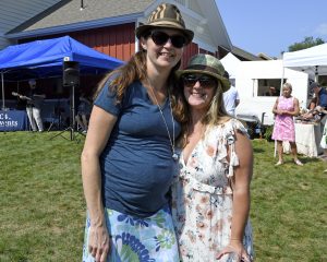 two women in fedoras and shades at 4th annual croquet on the green