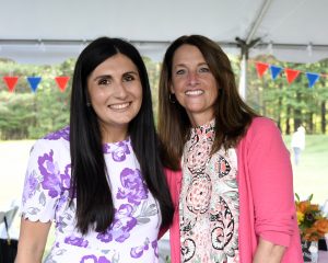 two women smiling at 4th annual croquet on the green