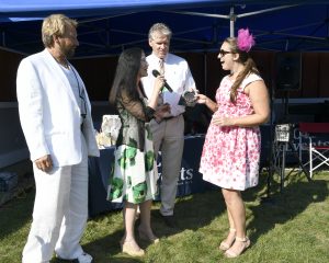 happy woman accepting bracelets at 4th annual croquet on the green