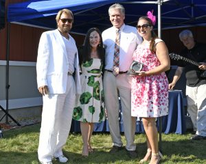 group shot showing off prize at 4th annual croquet on the green