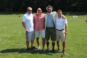 group of four having a great time at 4th annual croquet on the green