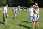 Group of men and women playing croquet at Croquet on the Green