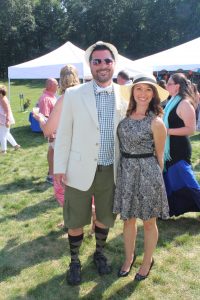 woman and man smile together wearing hats at 4th annual croquet on the green