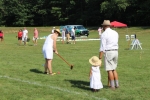 Family with young daughter playing croquet at Croquet on the Green