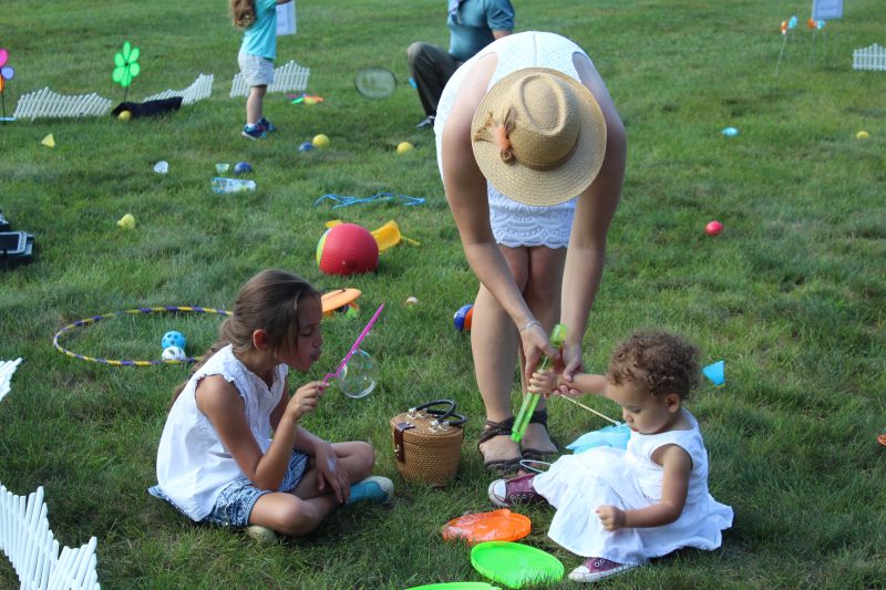 Croquet on the Green with Kids playing