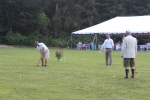 Croquet on the Green players watching man hit ball