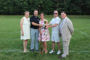 croquet winners accepting their winning trophy at 4th annual croquet on the green