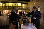 Brian Gwynn of Specialty Wines & More pouring a glass of wine for a woman at the Vin Le Soir event