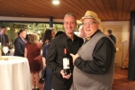 Keith Barnett pointing at Bill Blake holding a bottle of wine at the Vin Le Soir event