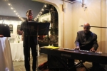 Azzaam Hameed playing keyboard with singer at Vin Le Soir event