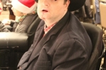Man in cowboy hat at Holiday Tea event