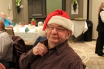 Man in a Santa hat at the Holiday Tea event