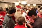 Group of people around Santa at Holiday Tea party
