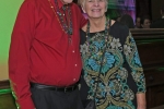 Couple smiling at Mardi Gras for AIM Services