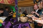 People at buffet at Mardi Gras for AIM Services