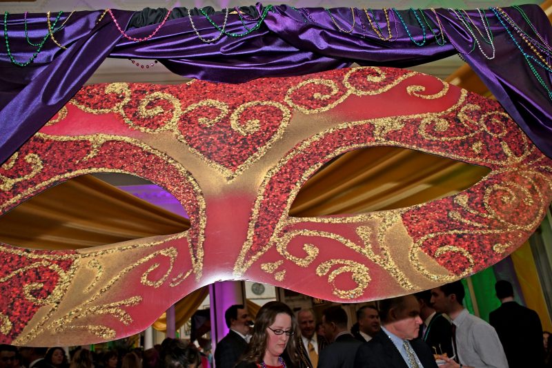 Large mask decoration at Mardi Gras for AIM Services